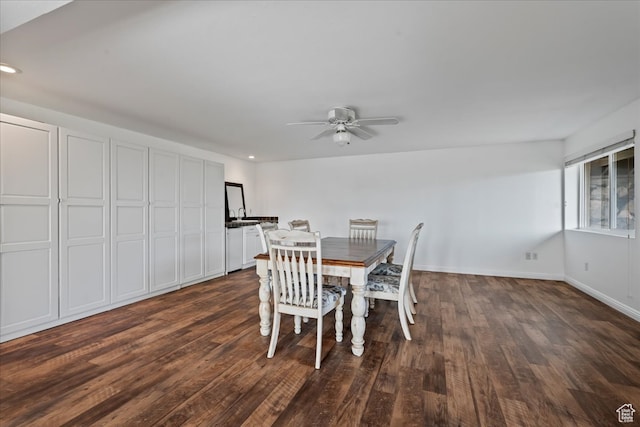 dining space with dark hardwood / wood-style floors and ceiling fan