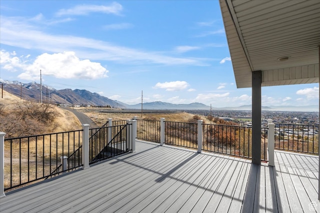 wooden deck with a mountain view