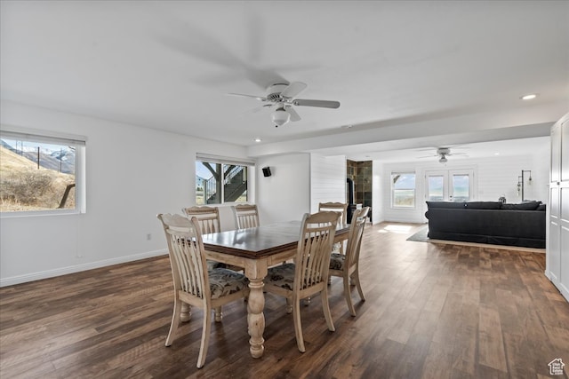dining room with ceiling fan, french doors, and dark wood-type flooring
