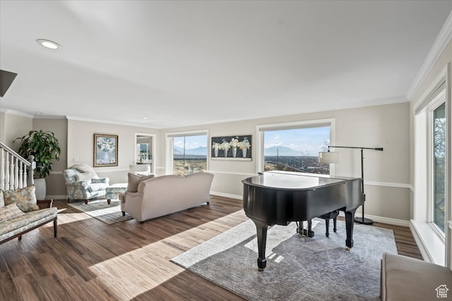 living room with dark hardwood / wood-style flooring and ornamental molding