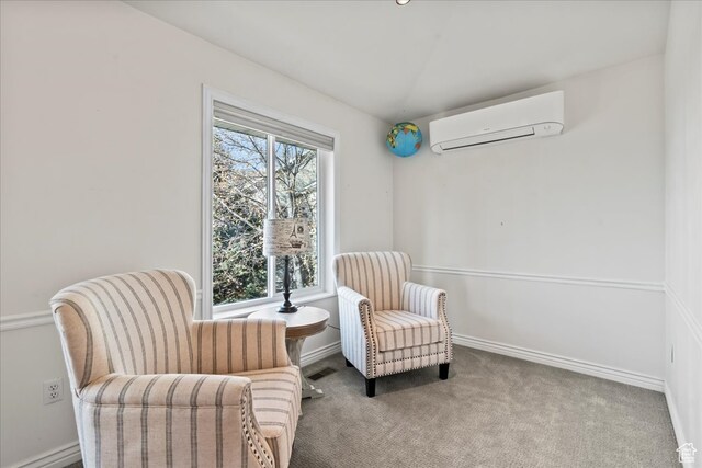 living area featuring a wall mounted air conditioner and carpet flooring