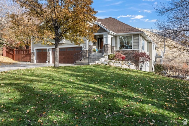 view of front facade featuring a garage and a front lawn