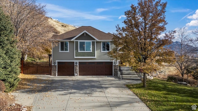 view of front of property featuring a garage and a front yard