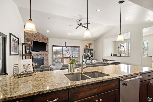 980 W White Cloud Trl, Hideout, UT 84036 - kitchen with a fireplace, sink, decorative light fixtures, and vaulted ceiling