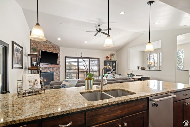 980 W White Cloud Trl, Hideout, UT 84036 - kitchen featuring vaulted ceiling, open floor plan, dark brown cabinetry, stainless steel dishwasher, and decorative light fixtures