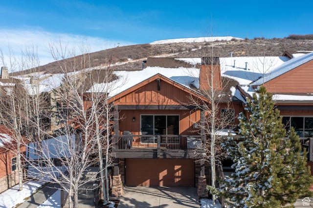 980 W White Cloud Trl, Hideout, UT 84036 - snow covered house with a garage