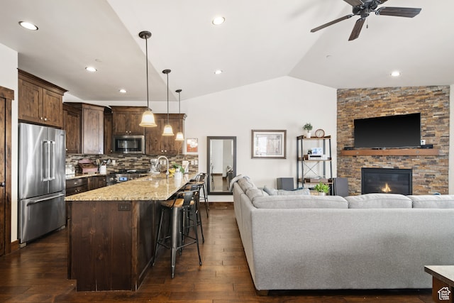 980 W White Cloud Trl, Hideout, UT 84036 - living room with ceiling fan, a fireplace, dark wood-type flooring, and lofted ceiling