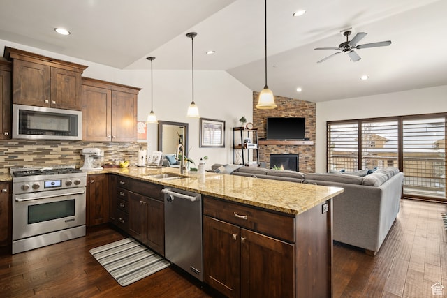 980 W White Cloud Trl, Hideout, UT 84036 - kitchen with sink, vaulted ceiling, dark hardwood / wood-style floors, kitchen peninsula, and stainless steel appliances