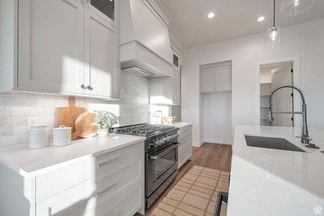 176 S 1150 E, Pleasant Grove, UT 84062 - kitchen featuring gas stove, a sink, premium range hood, tasteful backsplash, and recessed lighting