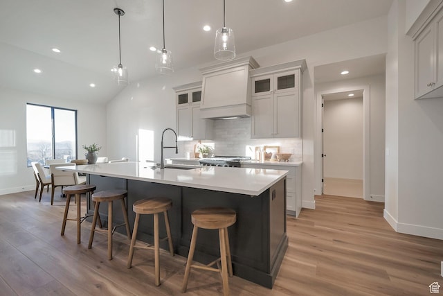 176 S 1150 E, Pleasant Grove, UT 84062 - kitchen with a sink, light wood-style floors, baseboards, recessed lighting, and lofted ceiling