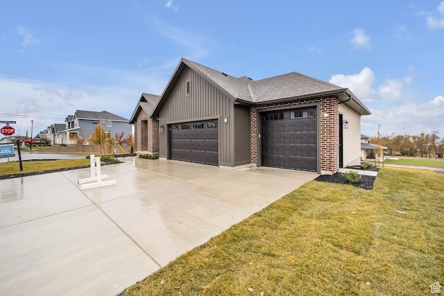 176 S 1150 E, Pleasant Grove, UT 84062 - view of home's exterior with a garage, concrete driveway, a lawn, board and batten siding, and brick siding