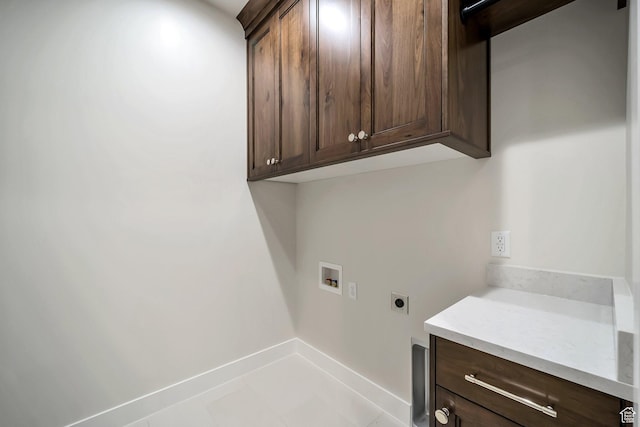 176 S 1150 E, Pleasant Grove, UT 84062 - laundry area featuring hookup for an electric dryer, cabinet space, washer hookup, light tile patterned floors, and baseboards