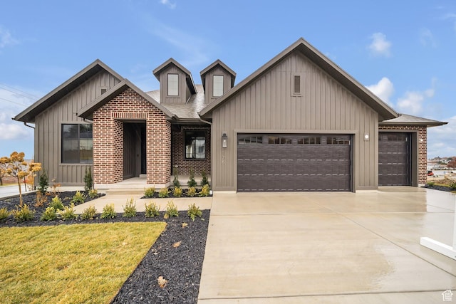 176 S 1150 E, Pleasant Grove, UT 84062 - view of front of house featuring board and batten siding, an attached garage, driveway, a front lawn, and a shingled roof