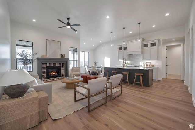 176 S 1150 E, Pleasant Grove, UT 84062 - living room with recessed lighting, light wood-style floors, healthy amount of natural light, a fireplace, and ceiling fan