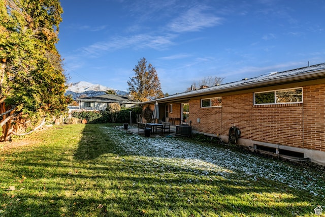 1983 E 1700 S, Salt Lake City, UT 84108 - rear view of property featuring central AC unit, brick siding, a mountain view, and a patio area