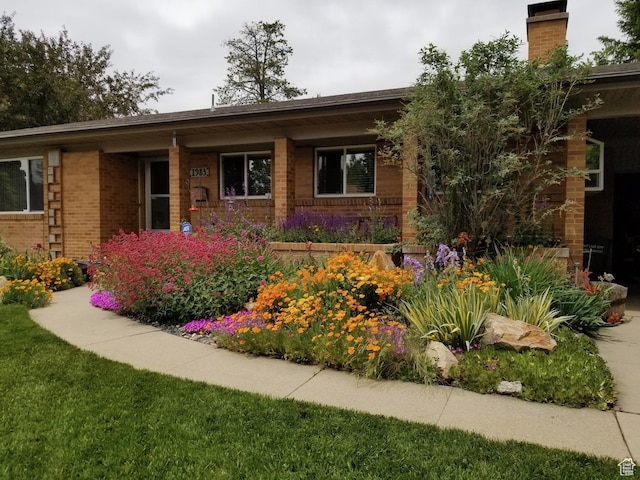 1983 E 1700 S, Salt Lake City, UT 84108 - view of front of property featuring a chimney, brick siding, and covered porch