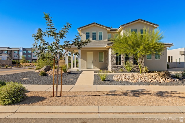 660 W Cypress Umber Dr, St George, UT 84790 - view of front facade with stucco siding, stone siding, and a tile roof