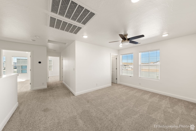 660 W Cypress Umber Dr, St George, UT 84790 - empty room with visible vents, light colored carpet, baseboards, and ceiling fan