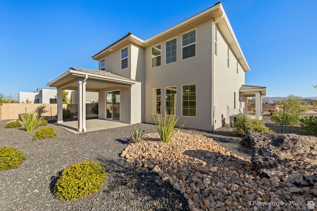 660 W Cypress Umber Dr, St George, UT 84790 - rear view of property with a patio, stucco siding, and fence
