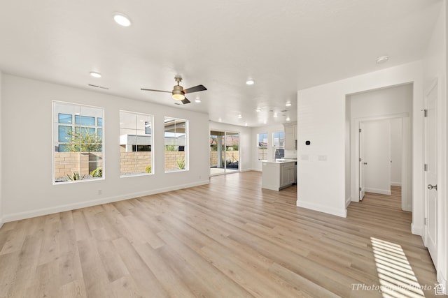 660 W Cypress Umber Dr, St George, UT 84790 - unfurnished living room with recessed lighting, light wood-style floors, and a ceiling fan