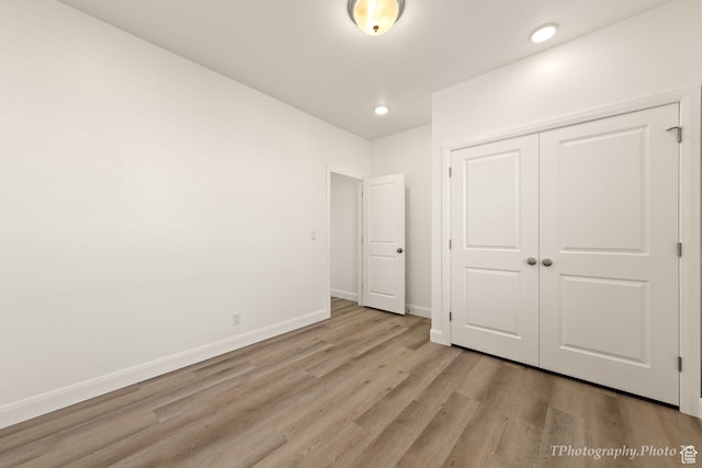 660 W Cypress Umber Dr, St George, UT 84790 - unfurnished bedroom featuring light wood-style floors, a closet, baseboards, and recessed lighting