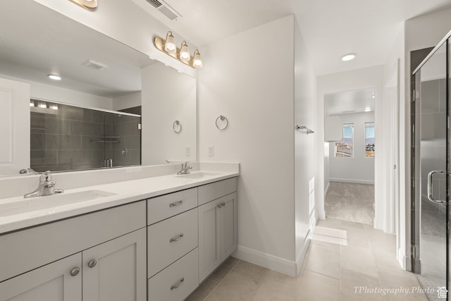 660 W Cypress Umber Dr, St George, UT 84790 - bathroom featuring visible vents, a sink, and a stall shower