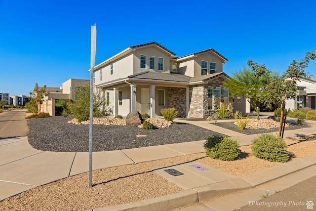 660 W Cypress Umber Dr, St George, UT 84790 - traditional-style home with a tile roof, stone siding, and stucco siding