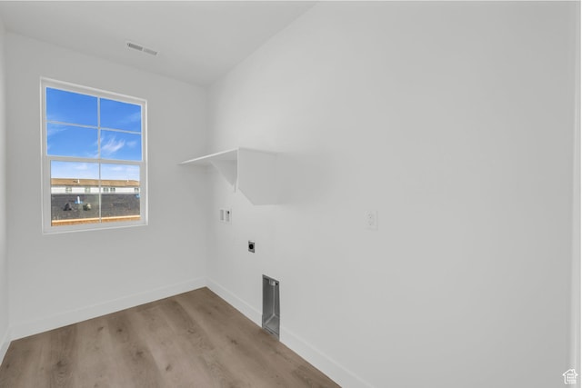 652 W Emerald Point Dr Unit 131, St George, UT 84790 - laundry area with baseboards, hookup for an electric dryer, and wood finished floors