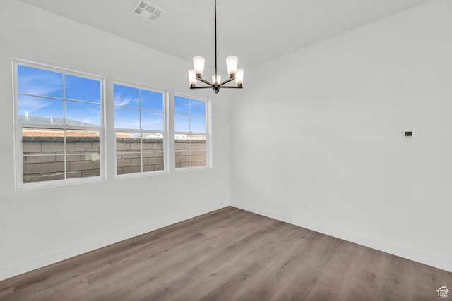 652 W Emerald Point Dr Unit 131, St George, UT 84790 - spare room featuring a chandelier, wood finished floors, and baseboards