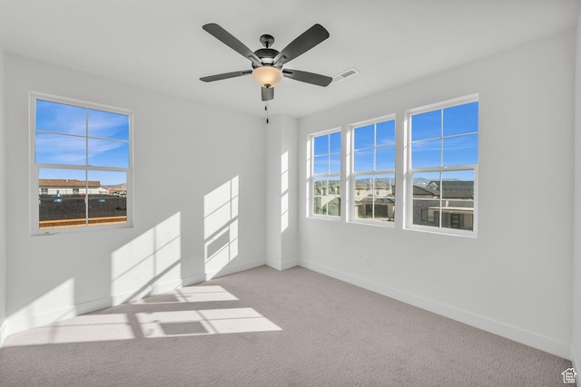 652 W Emerald Point Dr Unit 131, St George, UT 84790 - unfurnished room with baseboards, carpet, and ceiling fan