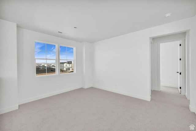 652 W Emerald Point Dr Unit 131, St George, UT 84790 - empty room featuring light colored carpet, a smoke detector, and baseboards