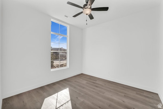 652 W Emerald Point Dr Unit 131, St George, UT 84790 - spare room featuring baseboards, wood finished floors, and a ceiling fan