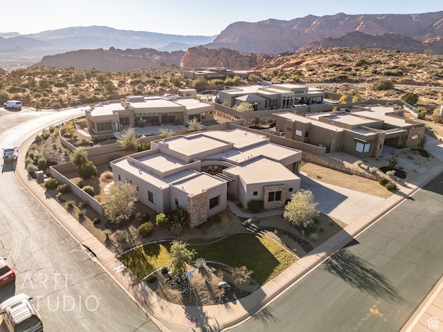 drone / aerial view featuring a residential view and a mountain view