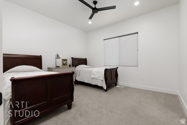 bedroom featuring recessed lighting, light colored carpet, ceiling fan, and baseboards