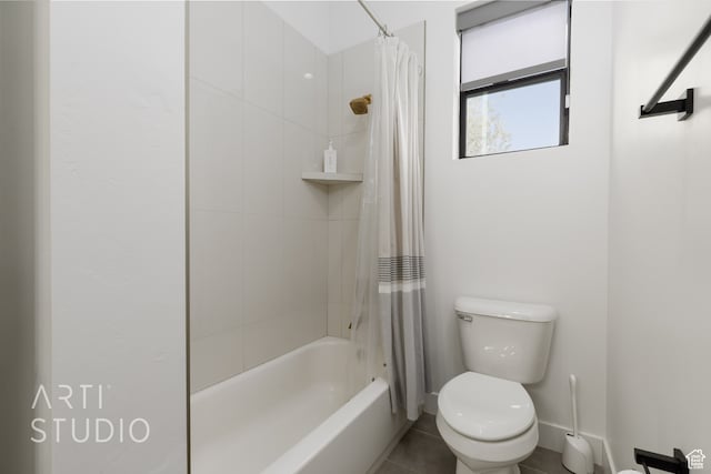 bathroom featuring tile patterned floors, baseboards, toilet, and shower / bath combo with shower curtain