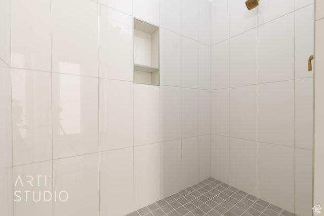 bathroom with a tile shower
