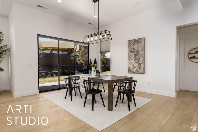 dining area with recessed lighting, baseboards, visible vents, and light wood finished floors