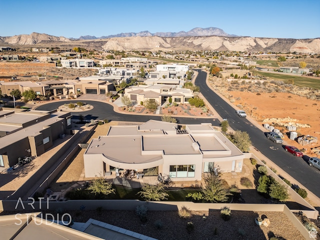 drone / aerial view with a residential view and a mountain view