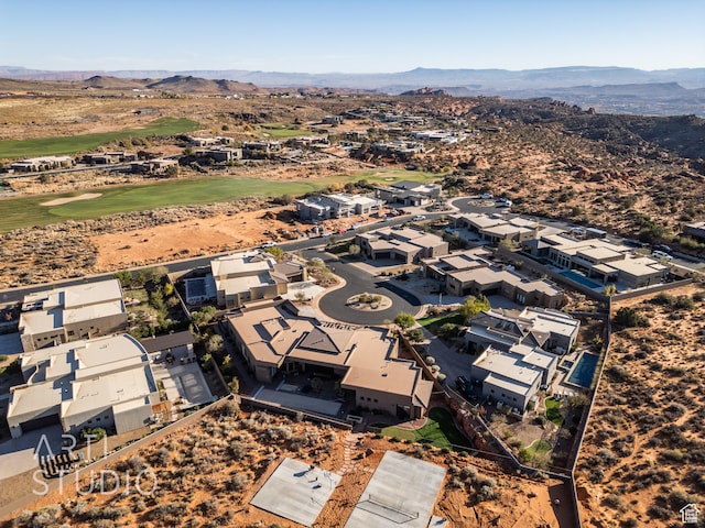 drone / aerial view featuring a residential view and a mountain view