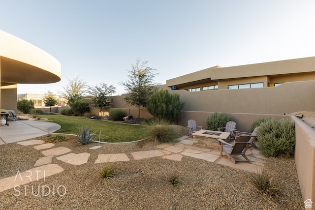 view of yard featuring an outdoor fire pit, a patio area, and fence private yard