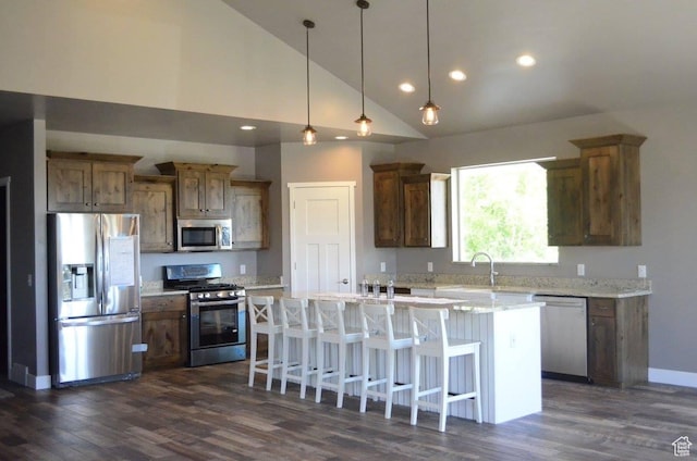 355 S 200 W, Orangeville, UT 84537 - kitchen featuring a breakfast bar, high vaulted ceiling, a kitchen island, dark hardwood / wood-style flooring, and stainless steel appliances