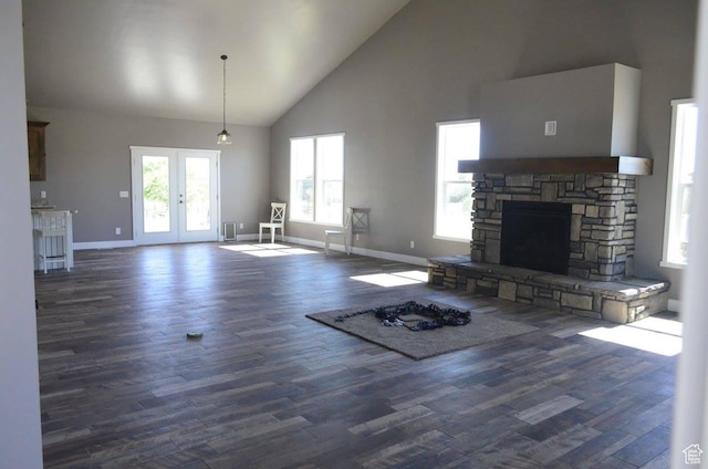 355 S 200 W, Orangeville, UT 84537 - unfurnished living room featuring a fireplace, dark hardwood / wood-style flooring, high vaulted ceiling, and french doors