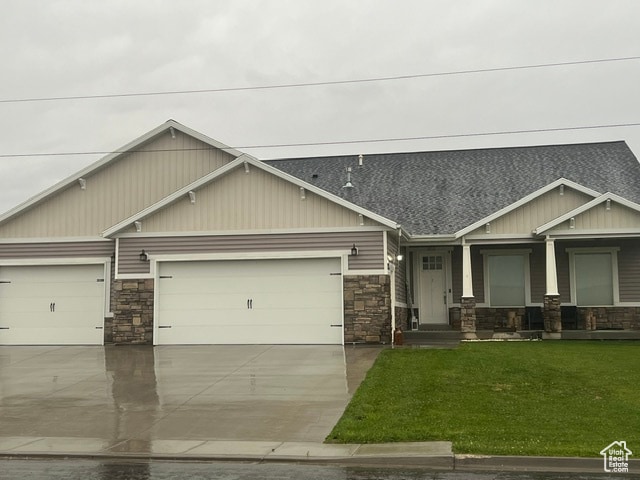 355 S 200 W, Orangeville, UT 84537 - craftsman house featuring a garage and a front lawn