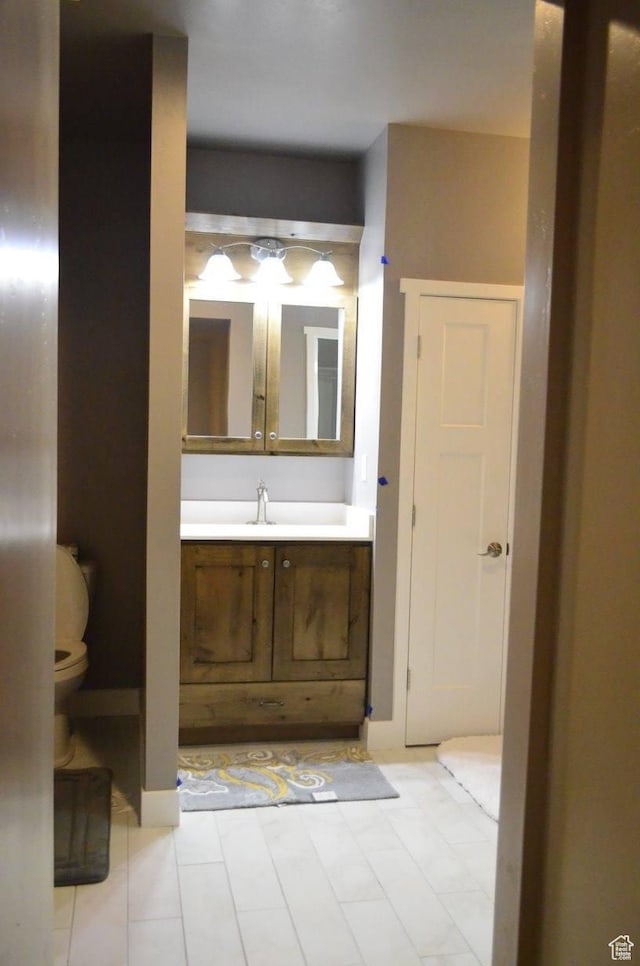 355 S 200 W, Orangeville, UT 84537 - bathroom with tile patterned floors, vanity, and toilet