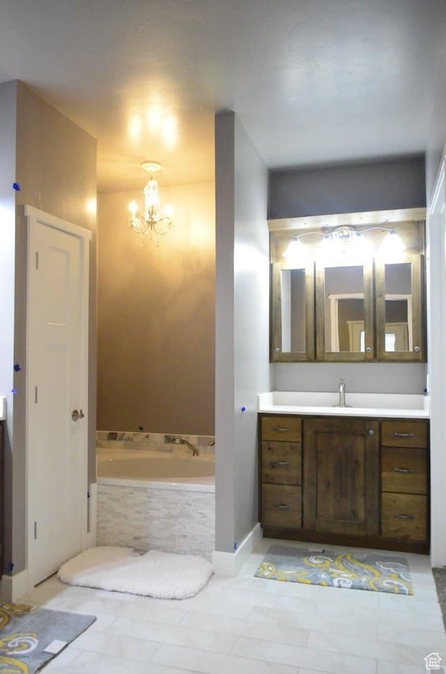 355 S 200 W, Orangeville, UT 84537 - bathroom with tiled tub, vanity, and a notable chandelier