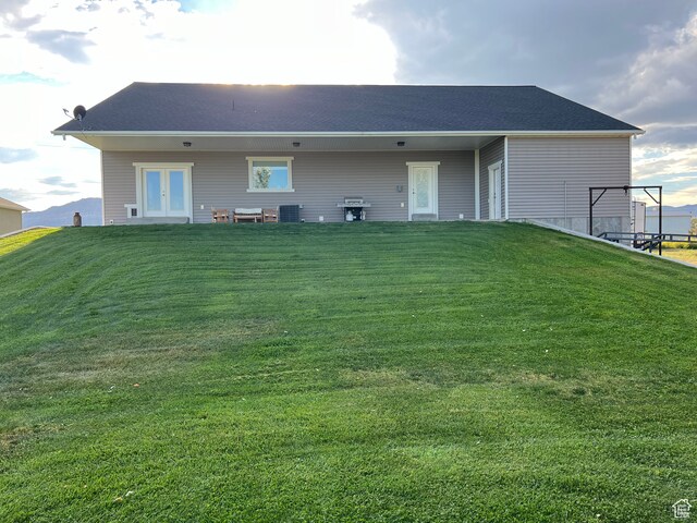355 S 200 W, Orangeville, UT 84537 - back of property with a lawn, french doors, and central AC unit