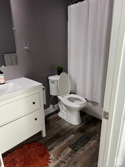 355 S 200 W, Orangeville, UT 84537 - full bathroom with hardwood / wood-style flooring, vanity, toilet, and shower / tub combo