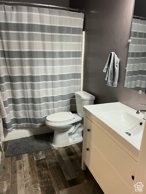 355 S 200 W, Orangeville, UT 84537 - bathroom featuring a shower with shower curtain, hardwood / wood-style floors, vanity, and toilet