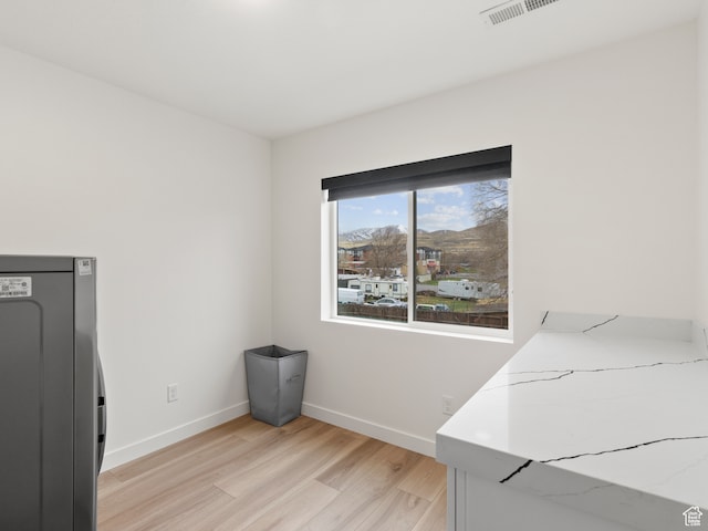 washroom featuring washer / dryer and light wood-type flooring