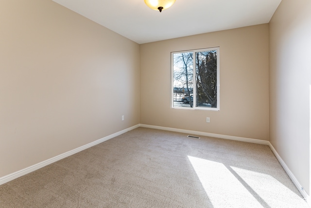 view of carpeted spare room